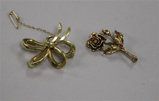 A 14ct gold (585) tied-ribbon brooch and a 9ct gold brooch in the form of a rose